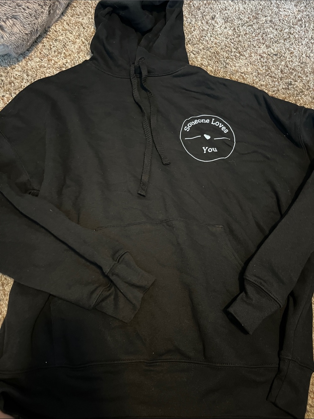 Bella Canvas Black Pullover Hoodie with White "Someone Loves You" Chest Graphic